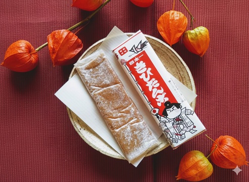 岡山土産の丸いきびだんごとの比較に使う、北海道きびだんごのイメージ写真。個別包装された平たい駄菓子。